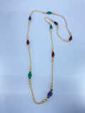 Long pearl beaded necklace with multi color textured beads