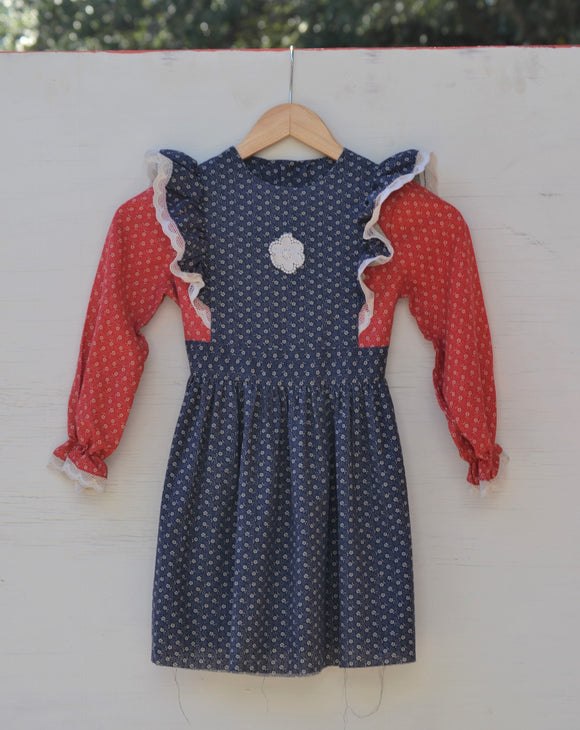 1970's Navy Blue & Red Prairie long sleeve apron dress with dainty white flowers