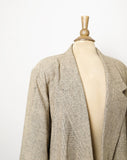 1980's ivory with black thread blazer with no buttons and shoulder pads.