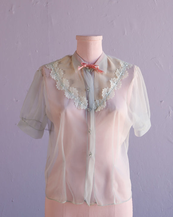 1950's Baby blue sheer top w/lucite buttons & pink bow tie