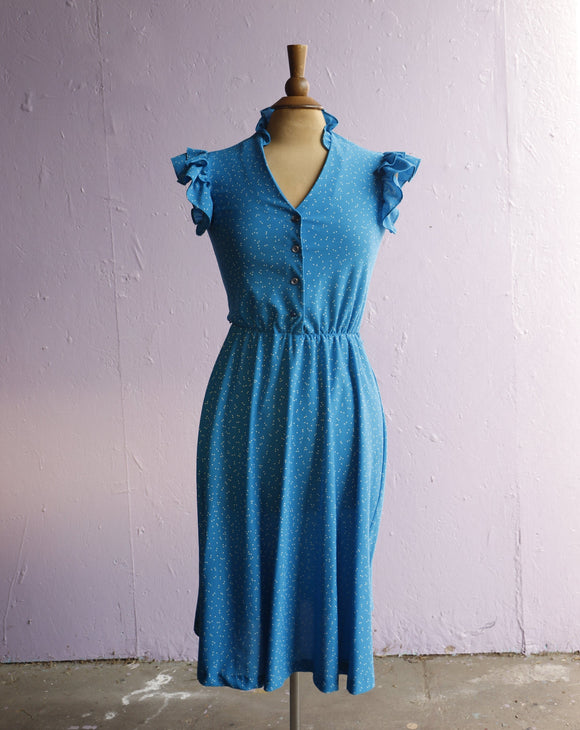 1970's Turquoise blue dress with white polka dots.