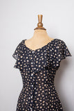 1990's Black sheer buttondown mini dress with dainty white floral print and capelet collar