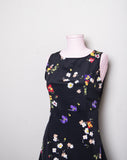 1990's Black mini sleeveless dress with red, purple, yellow & white wild flowers print