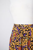1990's Gold & Black animal print plus size skirt with medallion & tassle print.