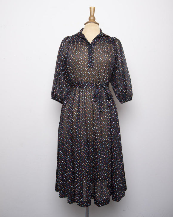 1970's Black sheer puff sleeve dress with rainbow polka dots.