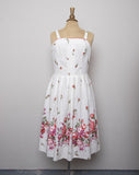 1970's Ivory sleeveless dress with black polka dots and red florals