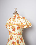 1970's Yellow floral mini dress with attached layered capelet