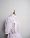 1970's Pink sheer polka dot prairie dress with puff sleeves, peplum skirt and laced highneck