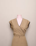 1970's Sleeveless Tan A-line dress with a faux wrap bodice and black trim detail