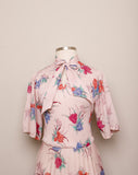 1970's Sheer Blush Pink tropical floral 3/4 sleeve, accordion pleated dress with pussy bow tie