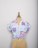 1980-90's Sky Blue short sleeve button down shirt with a floral red, blue and white quilt patchwork print